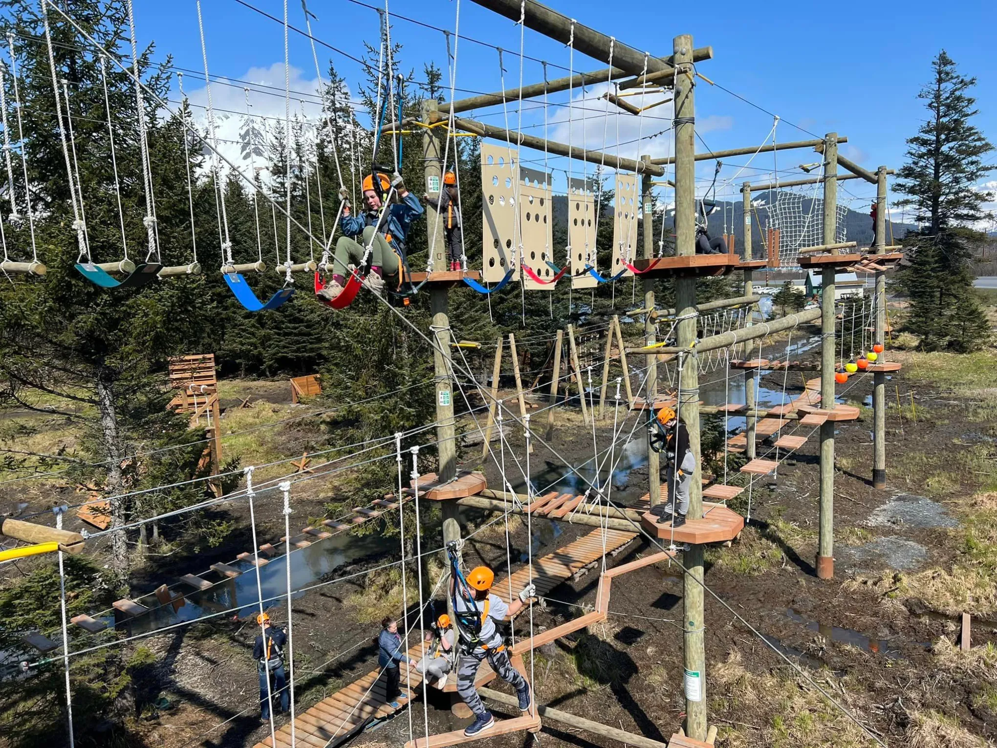 a group of people standing next to a fence