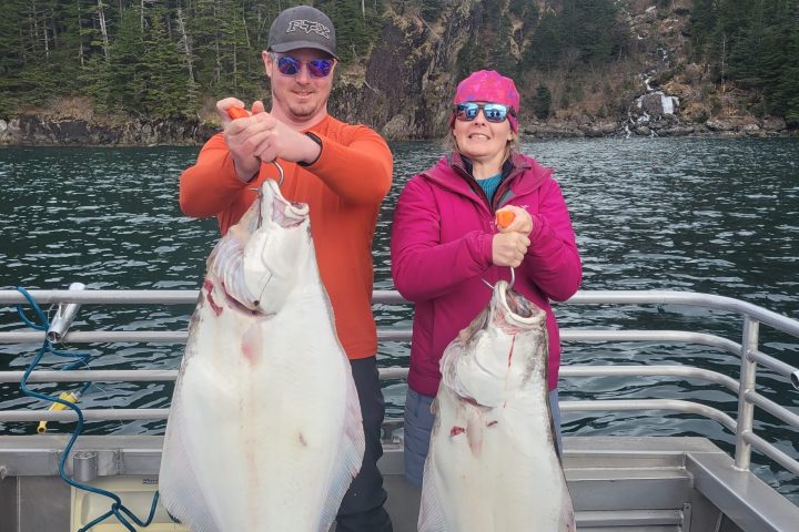 a person holding a fish