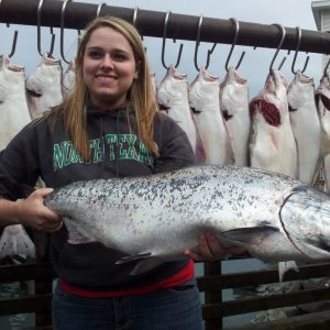 a person holding a fish