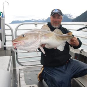 a man holding a fish