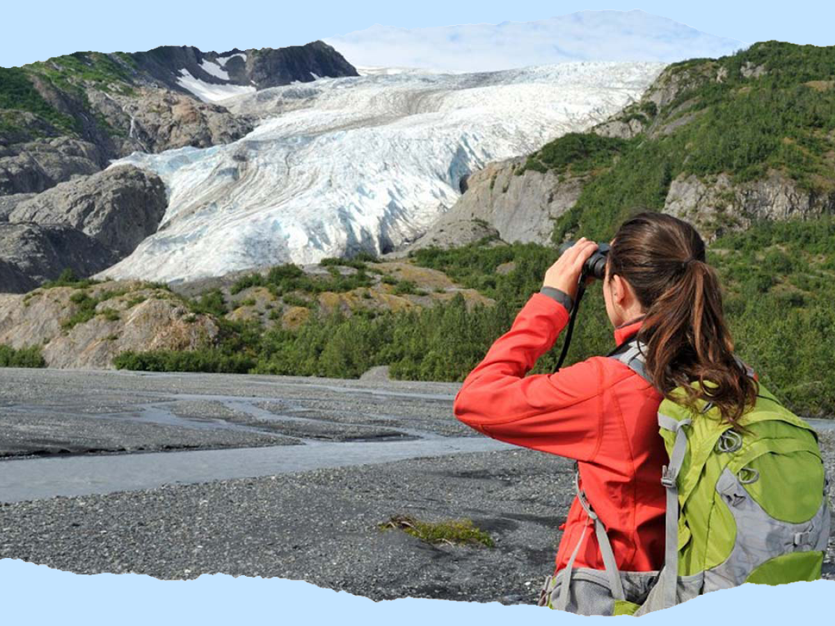 a girl sitting on a rock